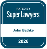 Badge displaying "Rated by Super Lawyers" with the name John Bathke and year 2026.
